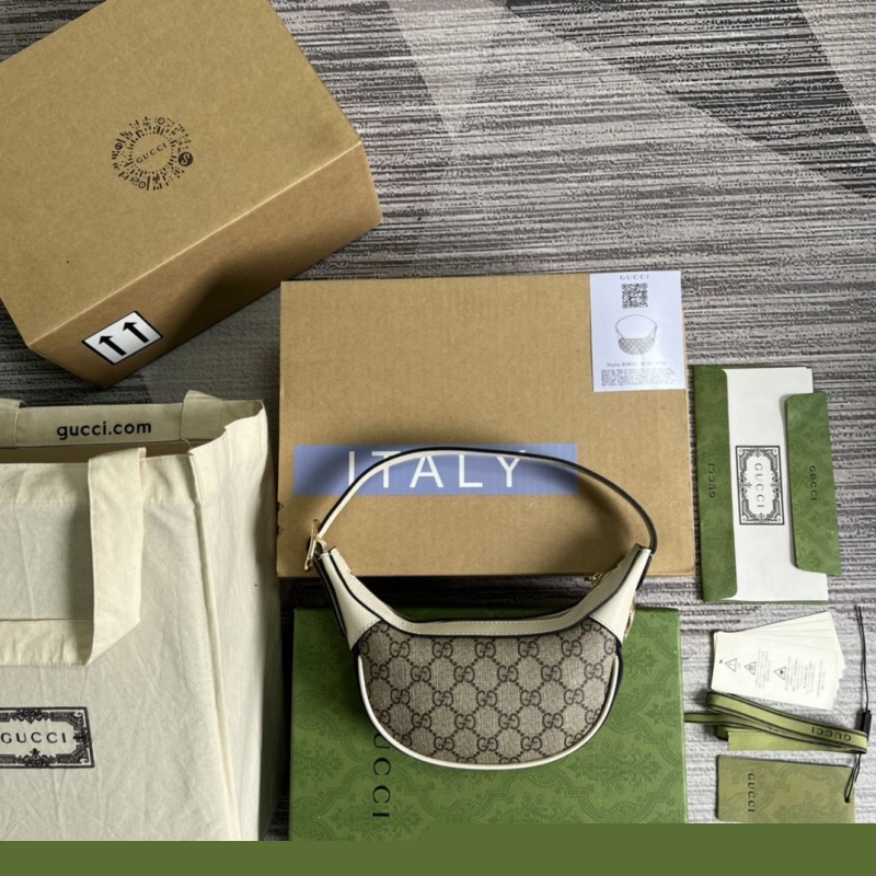 G*u*i top handle bags